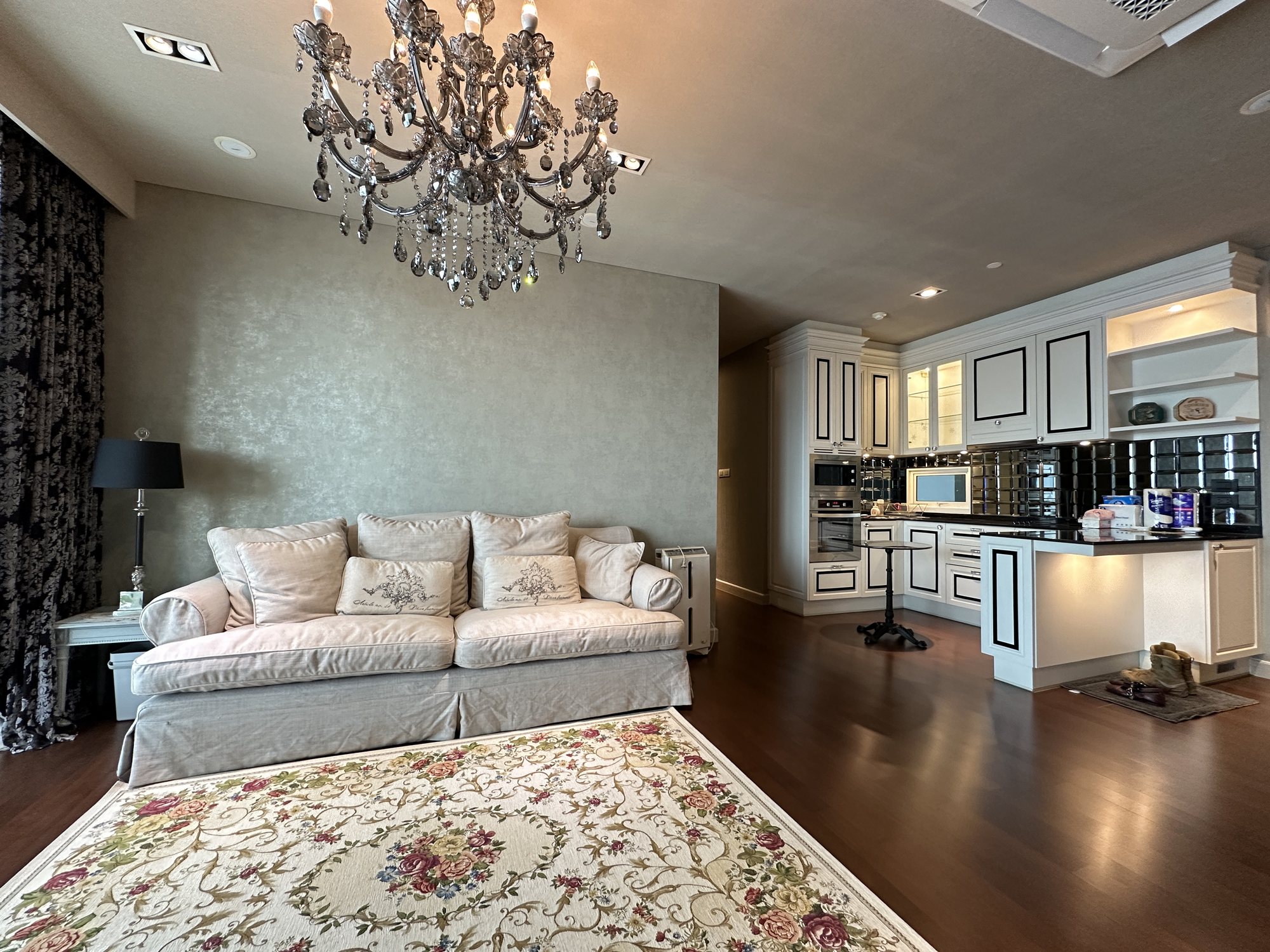 Living room with marble island and cabinetry