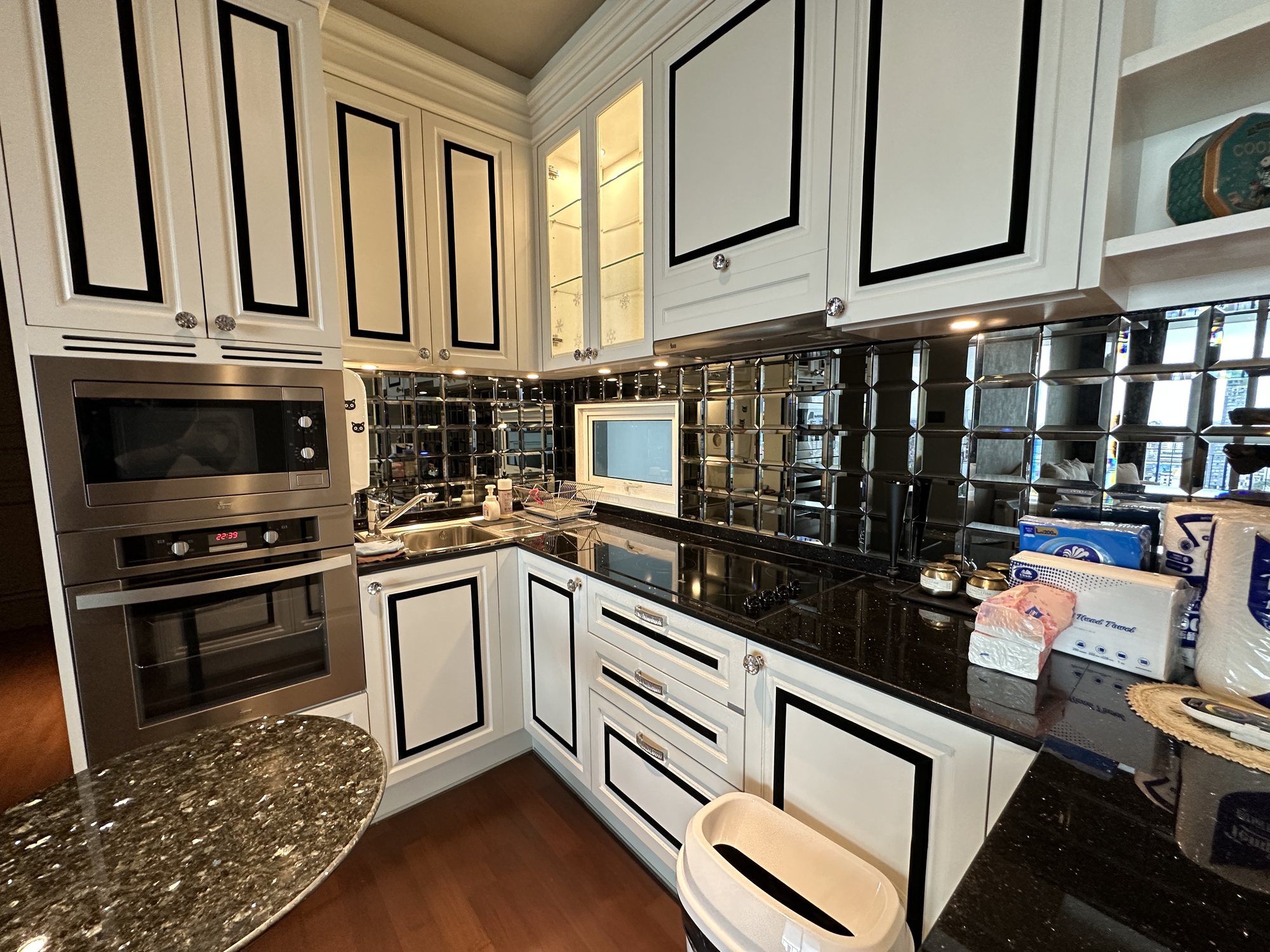 Kitchen with black granite and white cabinetry
